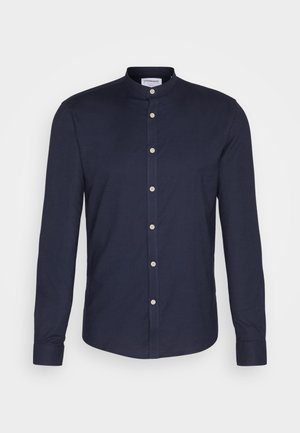 Marineblauwe overhemd met lange mouwen, met een bandkraag, een knoopsluiting aan de voorkant en manchetten met twee knopen. Gemaakt van een gladde, gestructureerde stof.