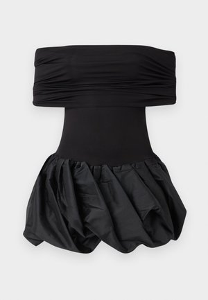 Black strapless dress with a ruched bodice and a voluminous, textured skirt. The skirt features a gathered design for added dimension.