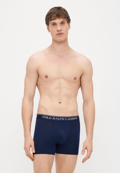 Tmavomodré bavlnené boxerky s čierno-bielym pásom s logom "POLO RALPH LAUREN", priliehavý dizajn a hladká textúra.