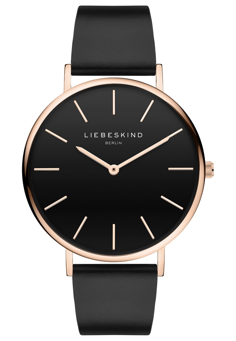 Runde schwarze Uhr mit goldenen Akzenten, minimalistisches Design, Lederarmband, einfache Stundenmarkierungen und ein Logo auf der Sechs-Uhr-Position.