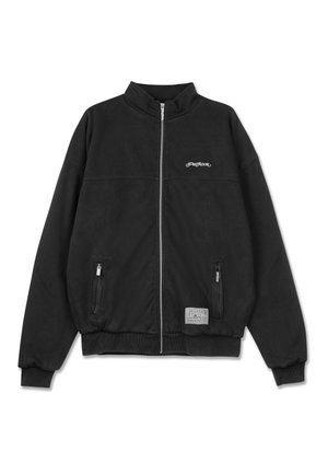 Black bomber jacket made of soft fabric, featuring a high collar, front zipper, and two side pockets with zip closures. Logo on chest.