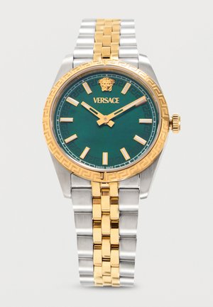 Orologio da polso Versace con quadrante verde, indici orari dorati, logo Medusa e bracciale in metallo bicolore argento e oro.