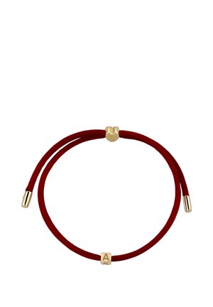 Red adjustable cord bracelet with gold heart-shaped slider and gold cube charm engraved with the letter A.