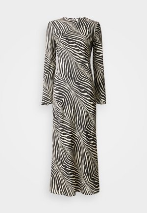 Abito a maniche lunghe con una stampa a strisce zebra nera e crema, caratterizzato da una linea dritta e scollatura rotonda, realizzato in tessuto liscio e leggero.