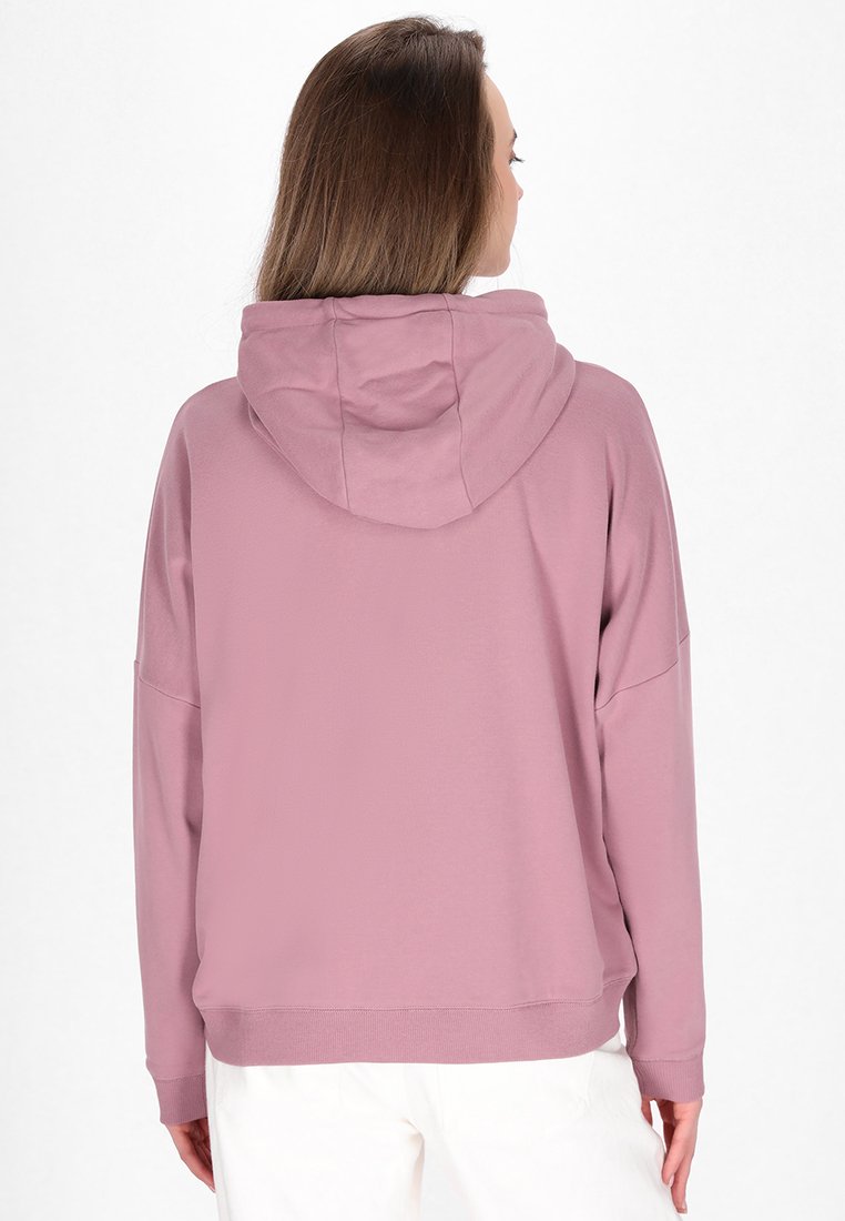 Kapuzensweatshirt aus weichem pinken Stoff, mit lockerer Passform, überschnittenen Schultern und geripptem Saum. Minimalistisches Design ohne sichtbare Muster.