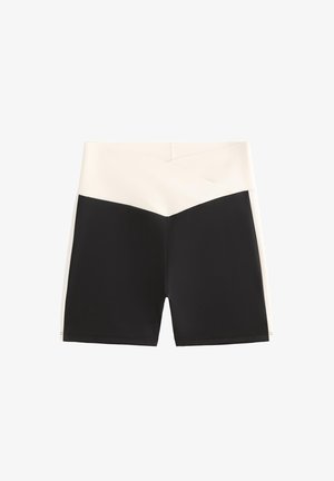 Sorte og cremefarvede crossover-designshorts. Fremstillet af strækbart materiale. Har en høj talje med kontrastfarvede blokke og en glat tekstur.