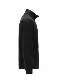 Giacca in pile nera con colletto alto, tasche laterali con zip e una consistenza liscia. Presenta una silhouette aderente senza pattern visibili.