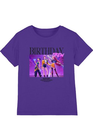 Purple t-shirt with "BIRTHDAY CREW" text and three animated female characters in colorful outfits from K-Pop Demon Hunters series.