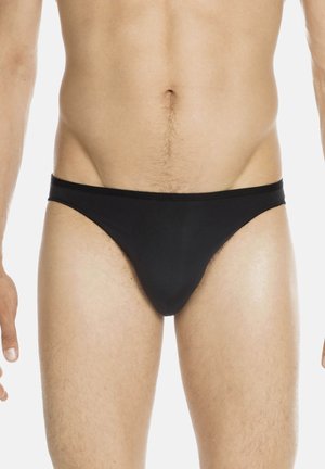 Schwarze Badehose aus glattem Material, mit einem schmalen Bund und einem minimalistischen Design, das eng an den Hüften sitzt.