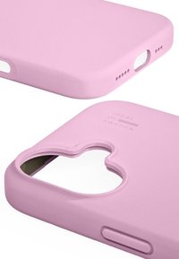 Pink silicone phone case with a cutout shape for branding, smooth texture, button access on the side, and subtle branding on the back.
