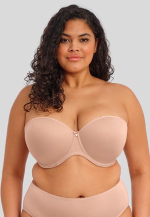 Nude strapless bh met een gladde stof, gevormde cups en een centraal decoratief detail. Eenvoudig ontwerp in een lichte tan tint.