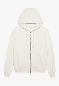 Biely zip-up mikina vyrobená z mäkkej tkaniny. Má kapucňu so sťahovacou šnúrkou, predné vrecká a rebrované manžety. Jednoduchý, minimalistický dizajn.