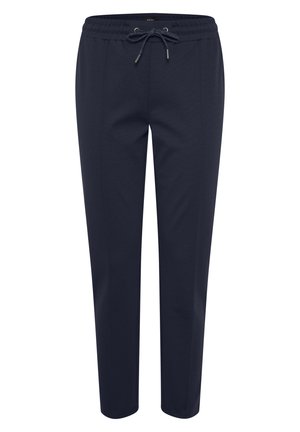Marineblå joggebukser med elastisk midje og snøring. Har smalere ben og glatt tekstur. Ingen synlige lommer eller mønstre.