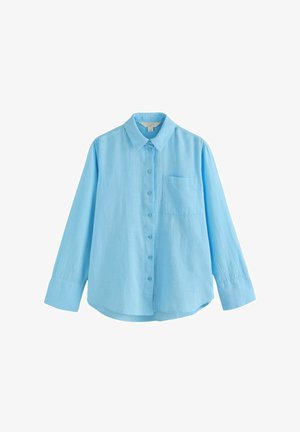 Lyseblå langærmet skjorte lavet af linned, med knapper foran, krave og en enkelt brystlomme. Glat tekstur.
