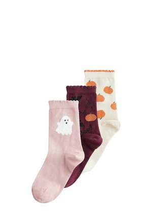 Set of three socks: pink with ghost design, maroon with bats and text "Boo!", cream with orange pumpkin patterns; textured knit fabric.