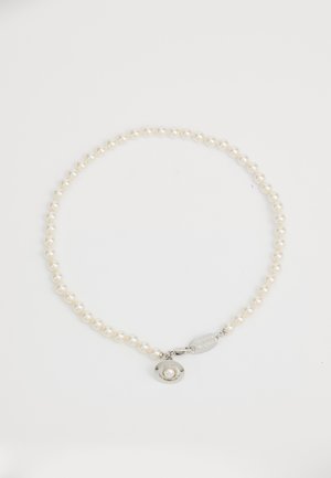 White pearl necklace featuring small round pearls and a silver clasp with a circular charm displaying a smaller pearl.