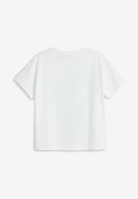 Hvid bomulds t-shirt med korte ærmer, rund halsudskæring og en afslappet pasform. Bagsiden har et glat, sømløst design.