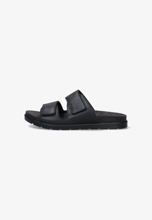Sandalo nero slip-on con due larghe cinghie regolabili e suola piatta, progettato per un uso casual.