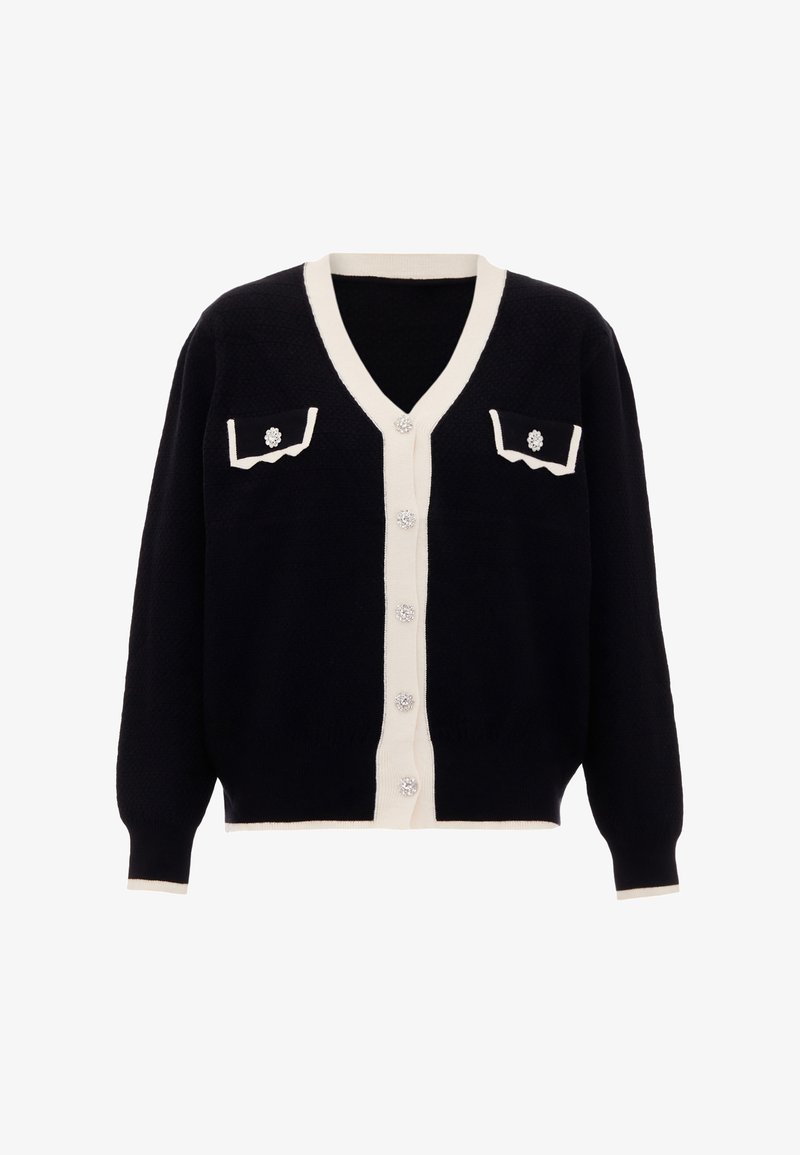 Sötét tengerészkék kardigán krém színű részletekkel, V-nyakkal, gombos elülső résszel, két mellzsebbel és virágmintás díszgombokkal.