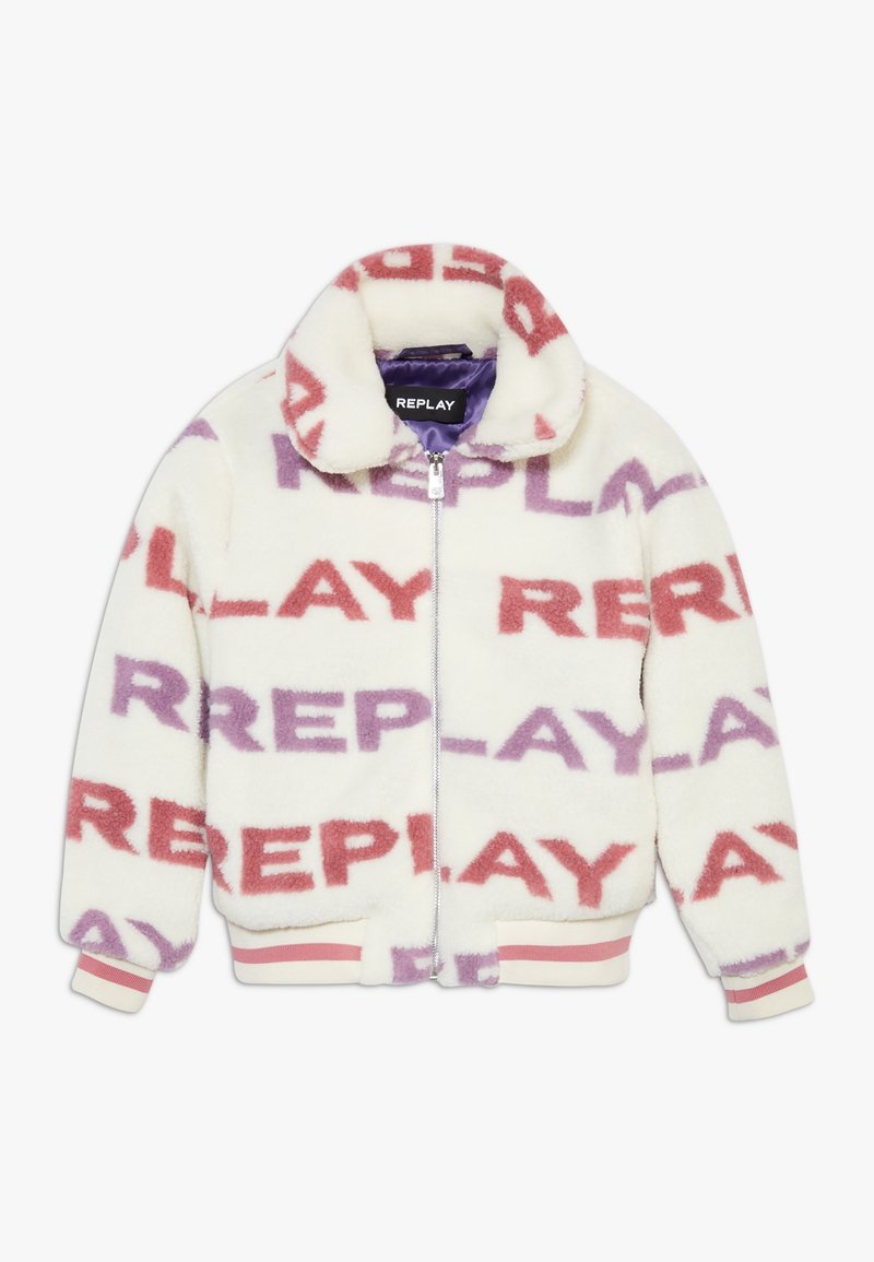 Veste en polaire crème avec un col montant, arborant un motif de logo répété en rose et violet. Fermeture zippée à l'avant et poignets côtelés rayés.