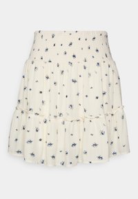 Kukkamekko, jossa on smockattu vyötärö. Valmistettu kevyestä kankaasta, jossa on kerma-valkoinen tausta ja sinisiä sekä vihreitä kukkakuoseja ja röyhelökerroksia.