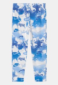 Legíny bílé barvy s designem modrých skvrn od barvy, na kterých jsou loga Nike. Jsou vyrobeny z pružného materiálu a mají přiléhavý střih.