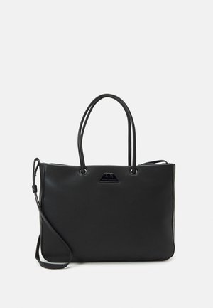 Black leather tote bag with double handles, a detachable shoulder strap, and a small triangular logo plaque on the front.