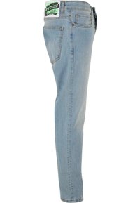 Vaaleansiniset farkut, joissa on kapea leikkaus, valmistettu denimmateriaalista. Ominaisuuksiin kuuluu viisi taskua ja merkkilogo takavyötäröllä.