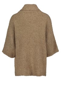 Beżowy sweter kardigan z krótkim rękawem, z fakturowaną, puszystą powierzchnią i kołnierzykiem. Prosty, kwadratowy kształt oraz luźny fason.