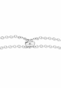 Sterling silver chain with round links and a polished oval clasp. The links are smooth and evenly spaced, creating a delicate appearance.