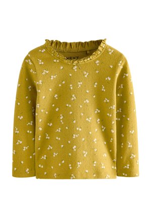 Langærmet top i sennepsgul med en rynket halsudskæring, der har spredte hvide blomstermønstre. Blød tekstur, afslappet design.