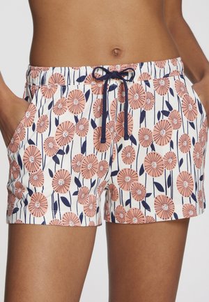 Floral shorts in white with pink and navy flower pattern, elastic waistband with drawstring, side pockets, cotton material, relaxed fit.
