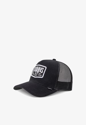 Black trucker cap featuring a textured front and mesh back, with a rectangular white logo patch and a curved brim.