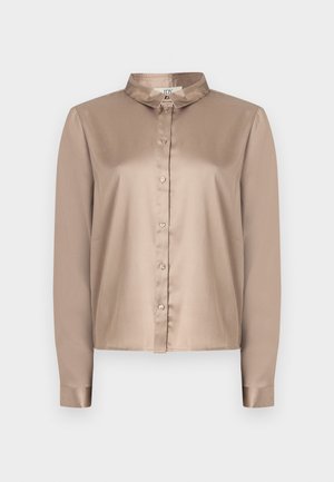 Satin long-sleeve blouse in light beige with a button-down front, pointed collar, and smooth texture. Features a relaxed fit and cuffed sleeves.