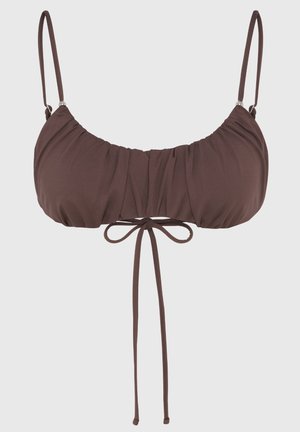 Brown bikini top featuring thin adjustable straps, a gathered front design, and a tied bow accent at the center. Soft stretch material.