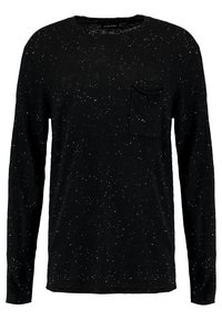 Maglietta nera a maniche lunghe con motivo a macchie bianche e piccola tasca sul lato sinistro, collo a giro.