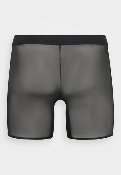 Boxers en maille noire avec une texture lisse et un design ajusté. Caractérisés par une ceinture élastique noire et une finition semi-transparente sur l'ensemble.