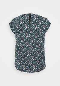 Blouse à manches courtes avec imprimé floral sombre en bleu, blanc, violet et vert, avec fermeture éclair au dos sur fond blanc.