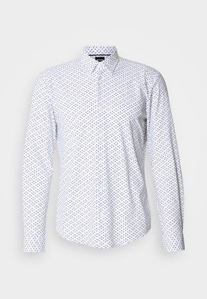 White long-sleeve shirt with a pattern of small black arrows. Features a button-down collar and front button closure. Soft fabric texture.