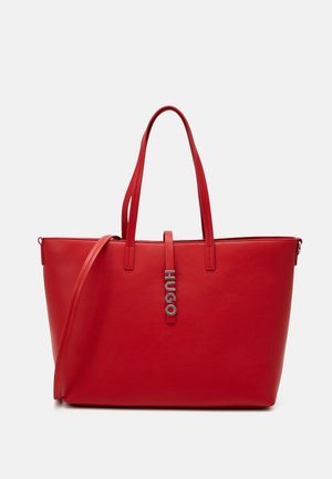 Rote Leder-Shopper-Tasche mit zwei Griffen und abnehmbarem Schulterriemen, mit einem vertikalen Metall-Logo mit dem Markennamen HUGO.