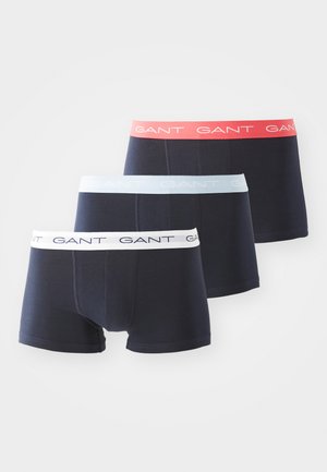 Boxers pour hommes en bleu marine, avec des ceintures élastiques contrastantes en rouge, bleu clair et blanc, ornées d'un logo en répétition.
