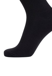 Black ankle sock made of a smooth, soft fabric with a knitted texture, featuring a rounded toe and no visible patterns or hardware.