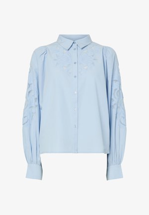 Light blue button-up blouse with long sleeves, feature embroidered floral designs on sleeves, pleated cuffs, and a classic collar.