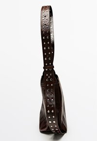 Brown leather bag with a structured shape, featuring a wide strap adorned with silver studs and a smooth texture.