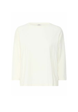 Fénykrém színű, könnyű pamut póló kerek nyakkivágással és háromnegyedes ujjakkal; ellazult fazonú, minta nélkül.