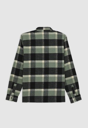 Long-sleeve shirt with green, black, and white large plaid pattern shown from the back on a light gray background.