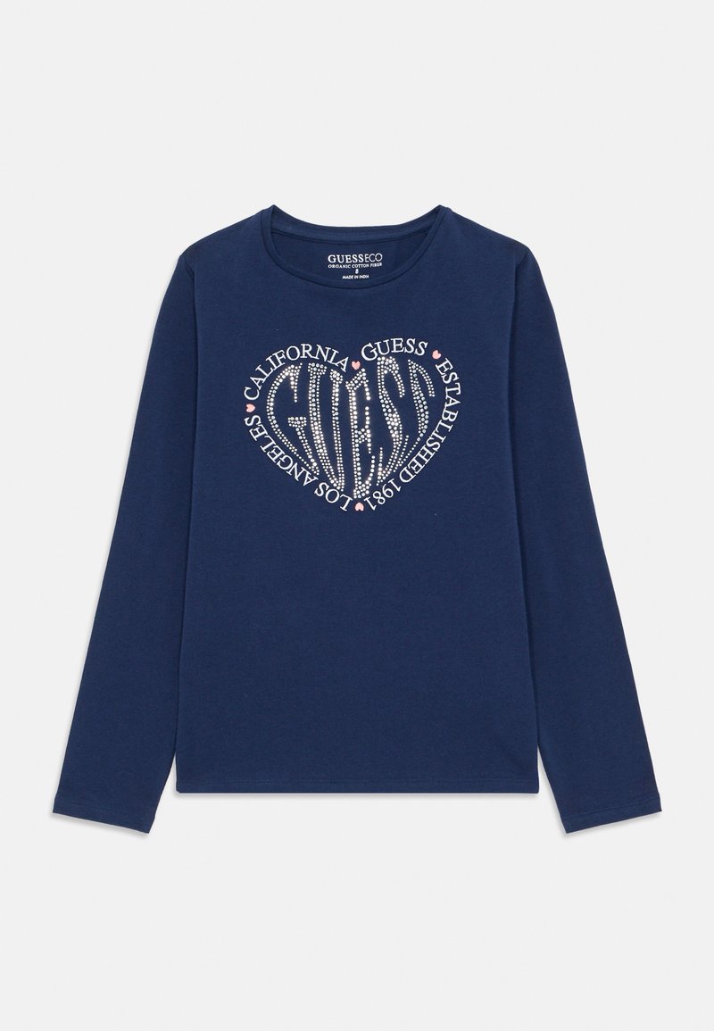 Marine langermet t-skjorte laget av bomull, med et hjerteformet rhinstein-design og teksten "CALIFORNIA GUESS ETABLERT 1981".