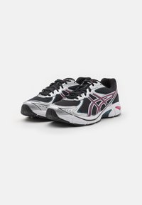 Black and silver athletic shoes featuring mesh and synthetic materials, angled lacing, rubber soles, and accent lines in pink and blue.