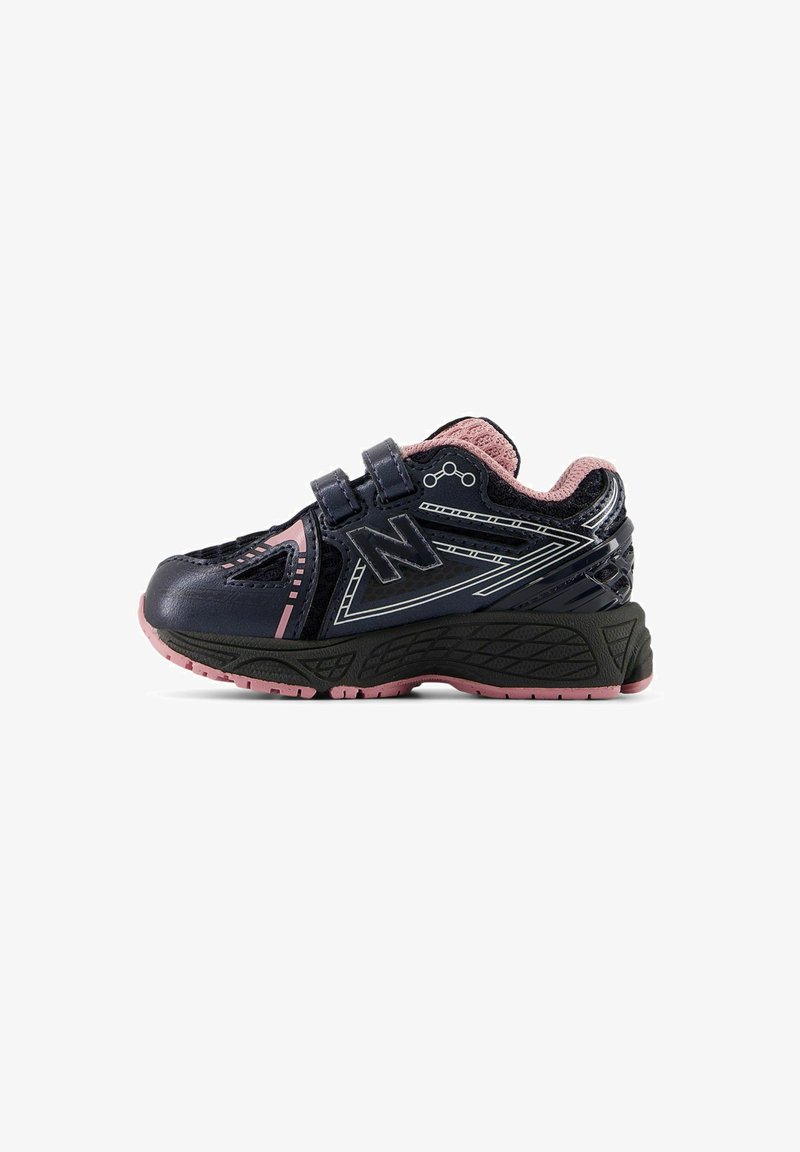 Dark navy athletic shoes with pink accents, featuring a breathable mesh upper, Velcro straps, and a textured black rubber sole.
