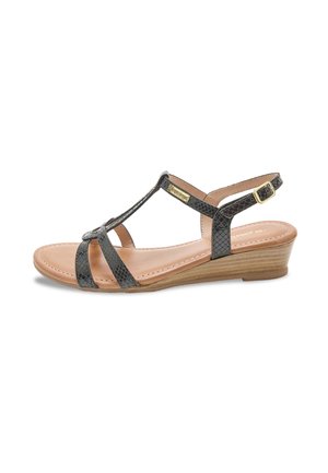 Wedge sandal with a black snakeskin pattern, adjustable ankle strap, and a beige cushioned footbed. Features a natural wood-like heel.